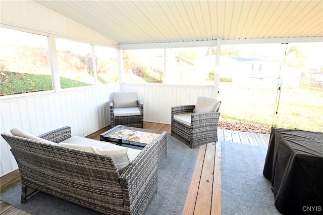 sunroom with vaulted ceiling and wood ceiling