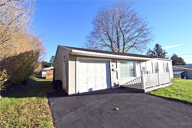 view of front of house with a garage and a front yard