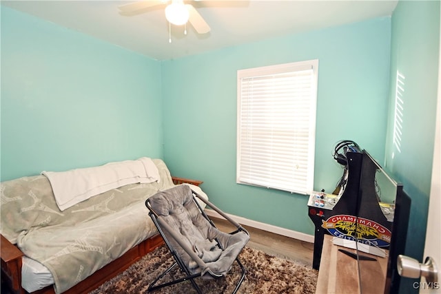 interior space with ceiling fan and hardwood / wood-style floors