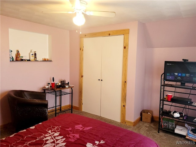 carpeted bedroom featuring ceiling fan and a closet