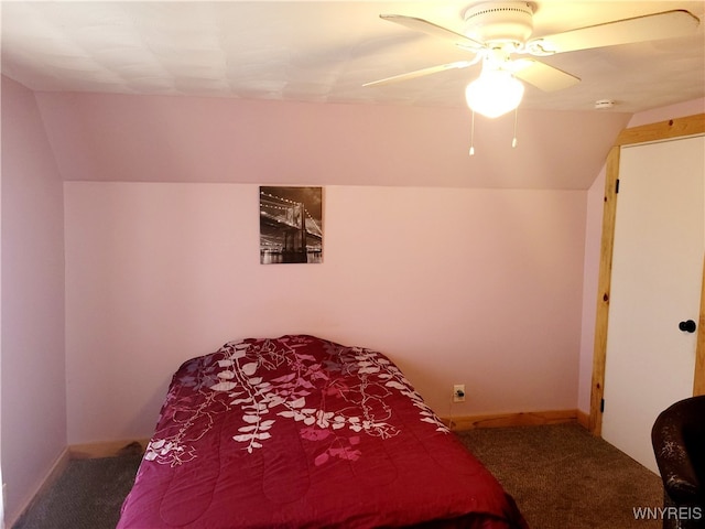 bedroom with carpet flooring, vaulted ceiling, and ceiling fan