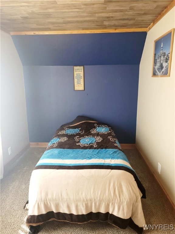 bedroom with carpet flooring, crown molding, lofted ceiling, and wood ceiling