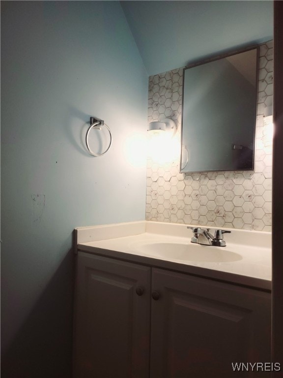 bathroom featuring backsplash and vanity