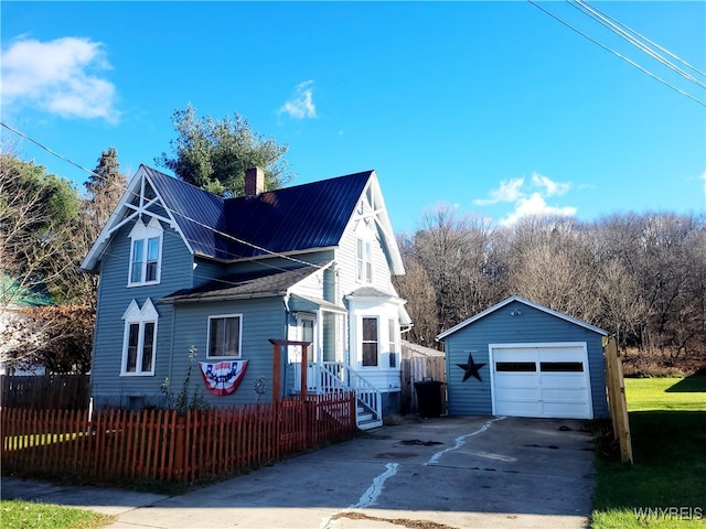 view of property exterior with an outbuilding and a garage