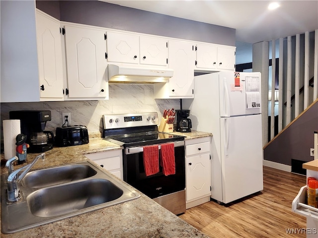 kitchen featuring stainless steel range with electric stovetop, white refrigerator, sink, light hardwood / wood-style flooring, and white cabinetry