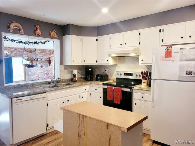 kitchen with light wood-type flooring, white appliances, white cabinetry, and sink