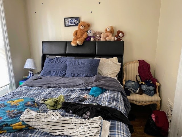 bedroom with hardwood / wood-style flooring