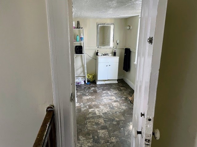 bathroom with a textured ceiling