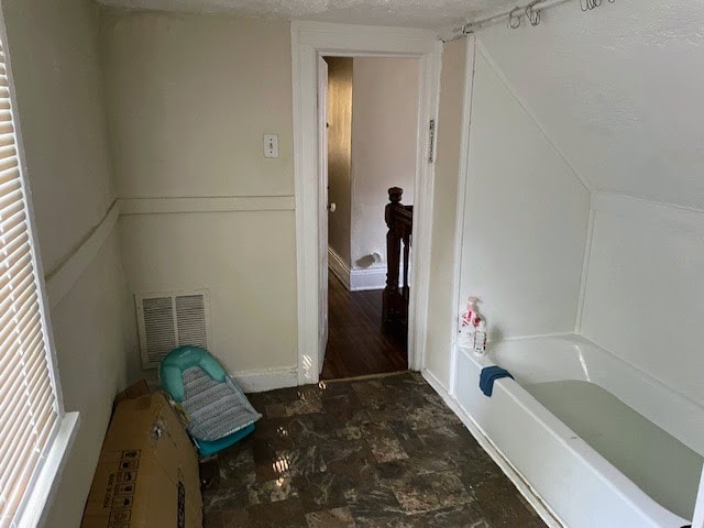 bathroom featuring a textured ceiling