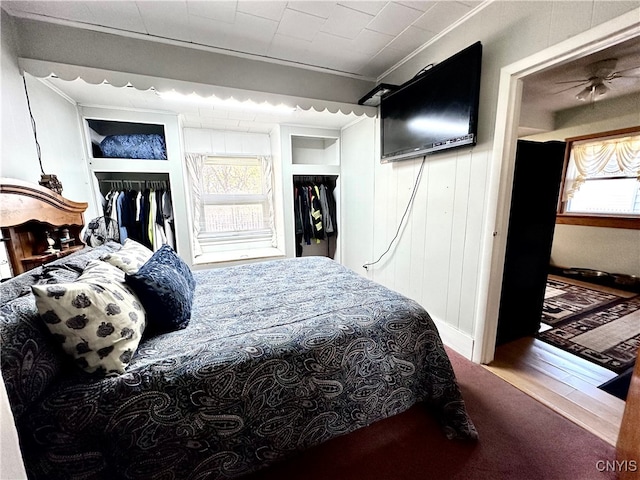 bedroom featuring a closet, carpet floors, and ornamental molding