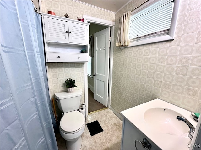 bathroom featuring vanity and toilet