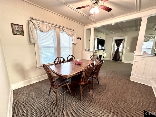 dining space with dark colored carpet, ceiling fan, and crown molding