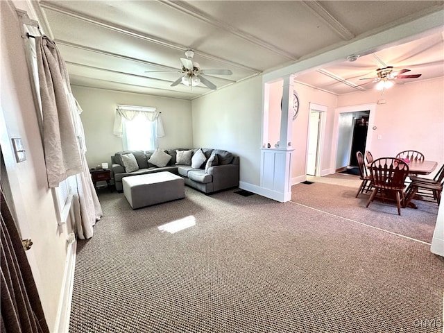 carpeted living room with ceiling fan