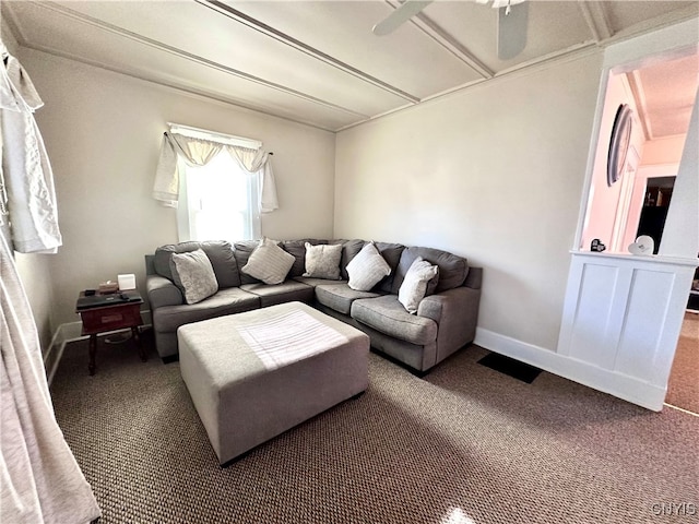 living room with ceiling fan and carpet