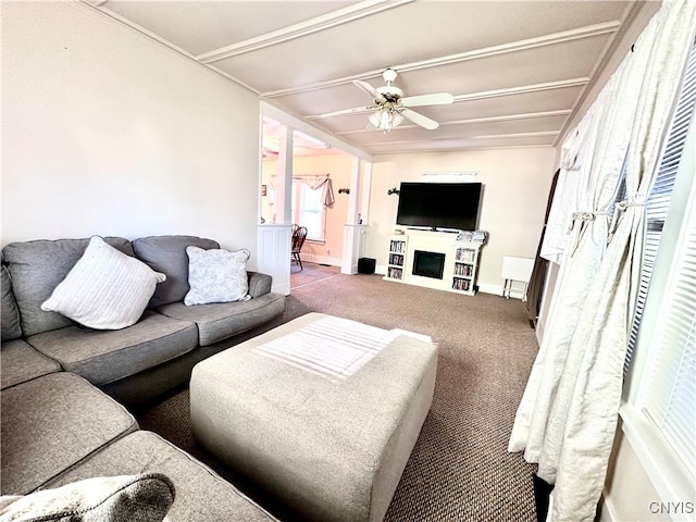 carpeted living room featuring ceiling fan