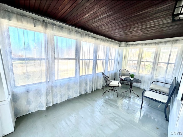 unfurnished sunroom featuring wood ceiling