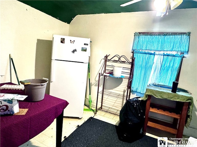 kitchen featuring ceiling fan and white refrigerator