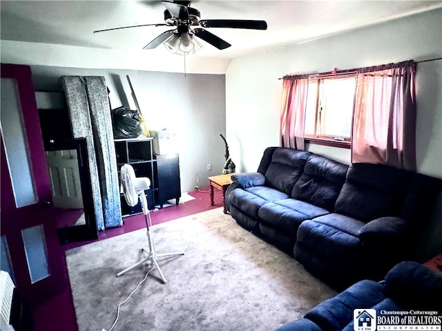 living room featuring carpet and ceiling fan