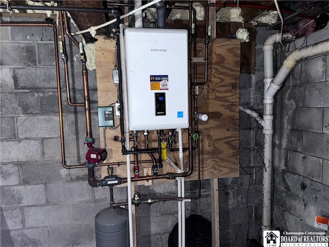 utility room featuring water heater