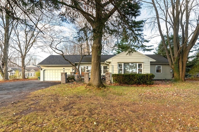 single story home with a garage