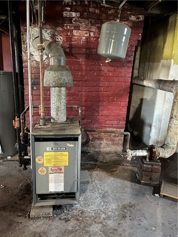 utility room with water heater