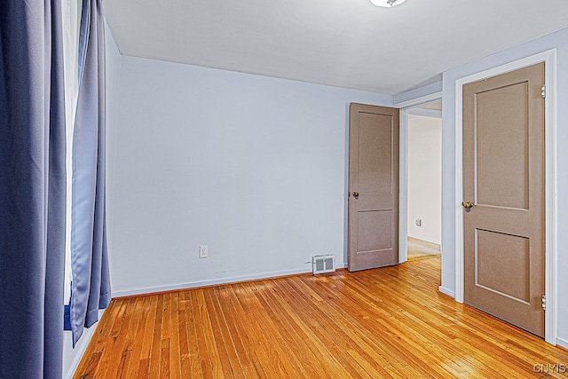 empty room featuring light hardwood / wood-style floors