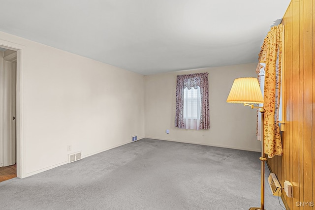 unfurnished room with carpet floors