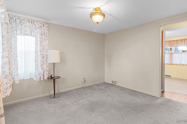 empty room with light colored carpet