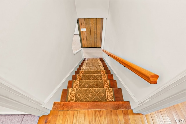 stairs with hardwood / wood-style floors