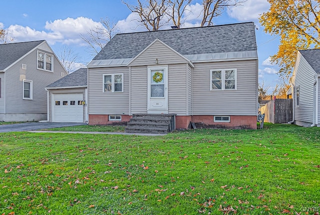 view of front of house with a garage and a front lawn