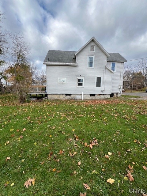 view of home's exterior featuring a lawn