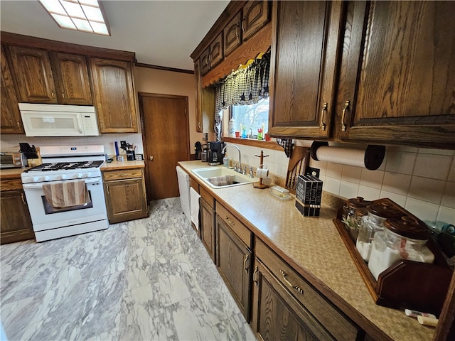 kitchen featuring white appliances, backsplash, ornamental molding, and sink