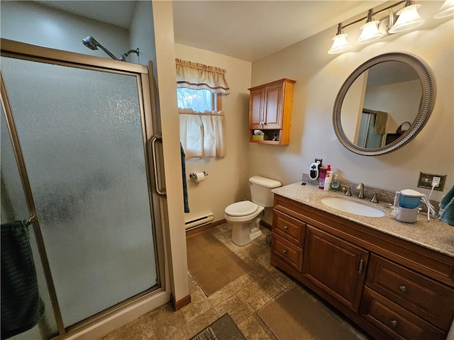 bathroom with vanity, a baseboard radiator, an enclosed shower, and toilet