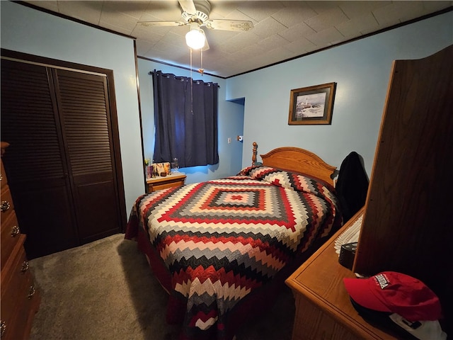 bedroom featuring ceiling fan, a closet, and dark carpet