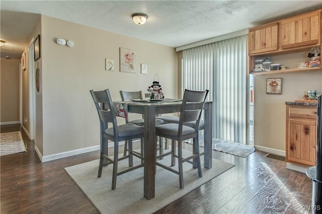 dining room featuring dark wood-type flooring