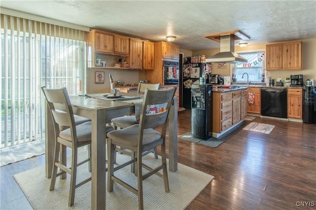 kitchen with black appliances, sink, a textured ceiling, dark hardwood / wood-style flooring, and island exhaust hood