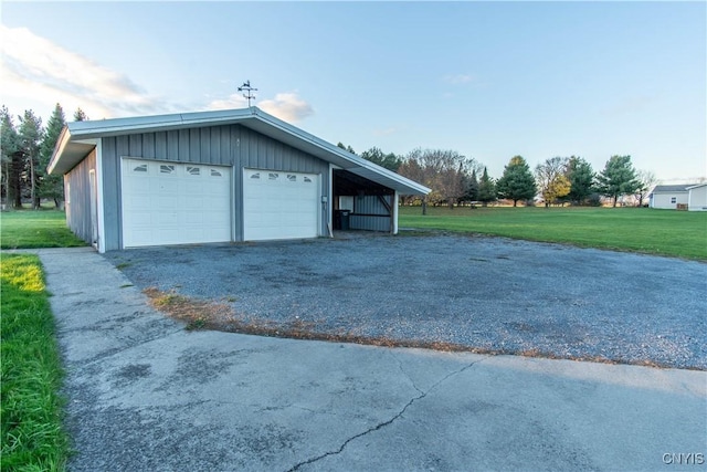 garage with a lawn