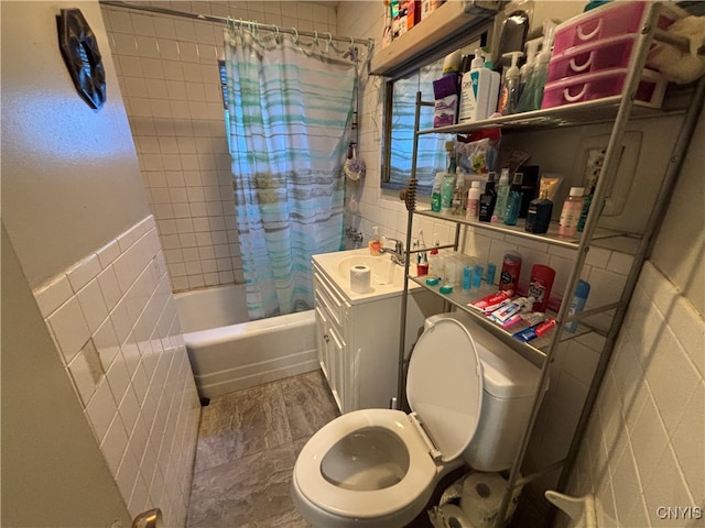 full bathroom featuring shower / bath combo, vanity, toilet, and tile walls