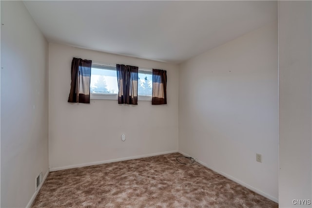 unfurnished room with carpet flooring