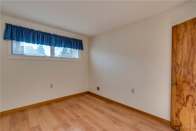 empty room featuring hardwood / wood-style flooring