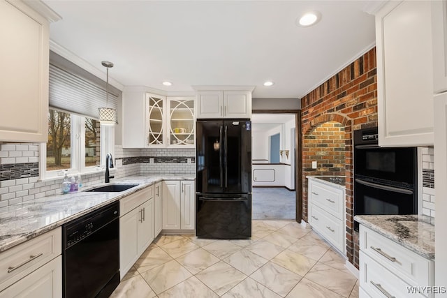 kitchen with ornamental molding, sink, black appliances, white cabinetry, and hanging light fixtures