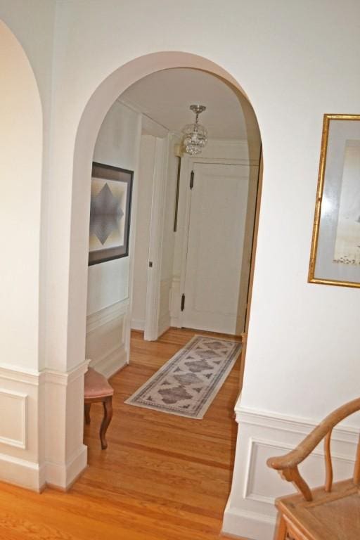 corridor with light hardwood / wood-style floors