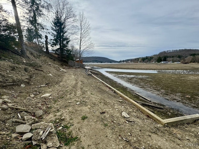 view of road featuring a rural view and a water and mountain view