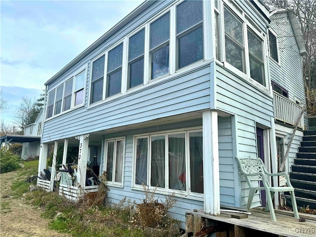 view of property exterior featuring a porch