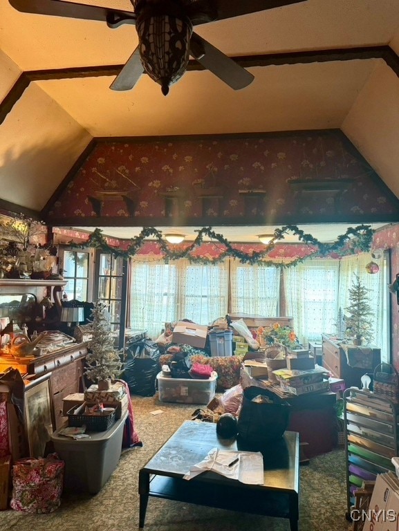 interior space featuring ceiling fan and lofted ceiling