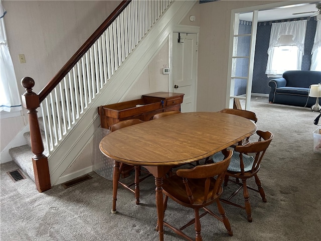 view of carpeted dining area