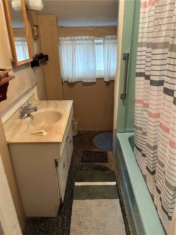 bathroom with vanity and shower / tub combo