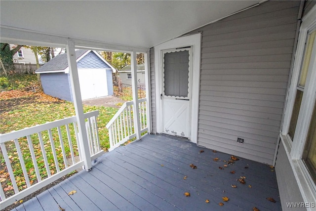 wooden deck with a shed