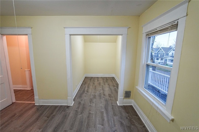 hallway featuring dark hardwood / wood-style floors