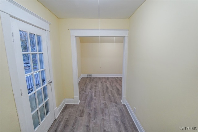 hallway featuring wood-type flooring